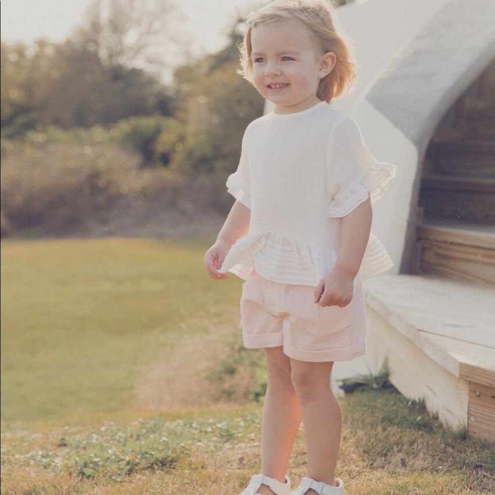 White cotton ruffle bottom top